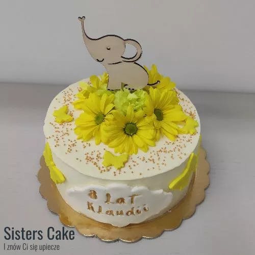 Tort z topperem słonika i kwiatami